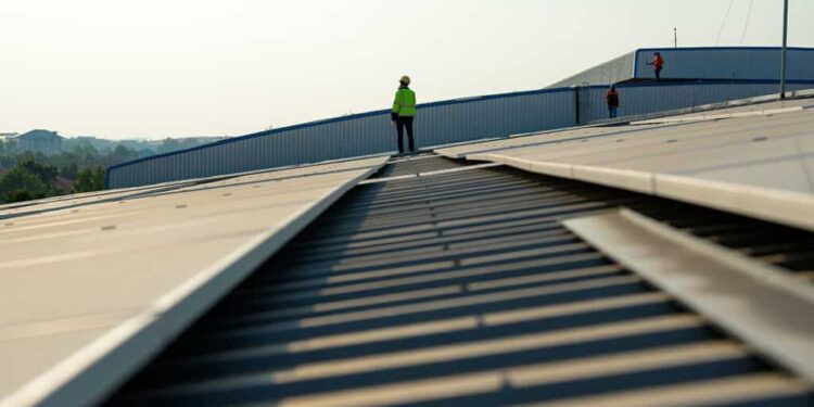 Professional engineer technician with safety helmet checking system. High quality photo